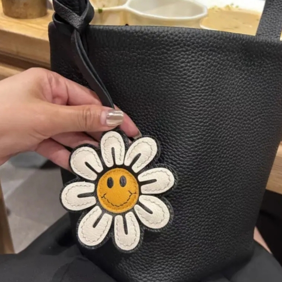 Handbags - Bag charm with Smiley Daisy NWT